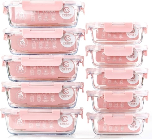 Six pink plastic containers with matching lids arranged neatly on a surface, showcasing their vibrant color and design.