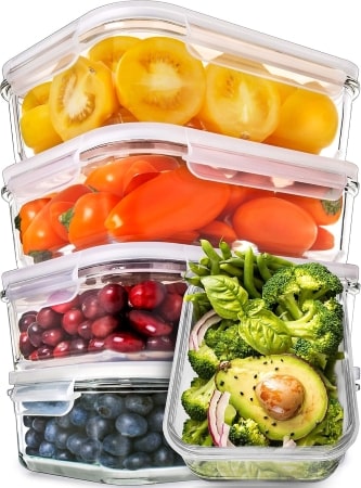 Four clear plastic containers filled with various types of food, showcasing a colorful and organized meal prep setup.