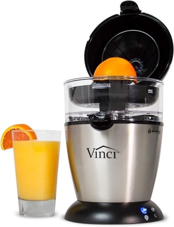 A juicer filled with a fresh orange, ready to extract juice for a refreshing drink.