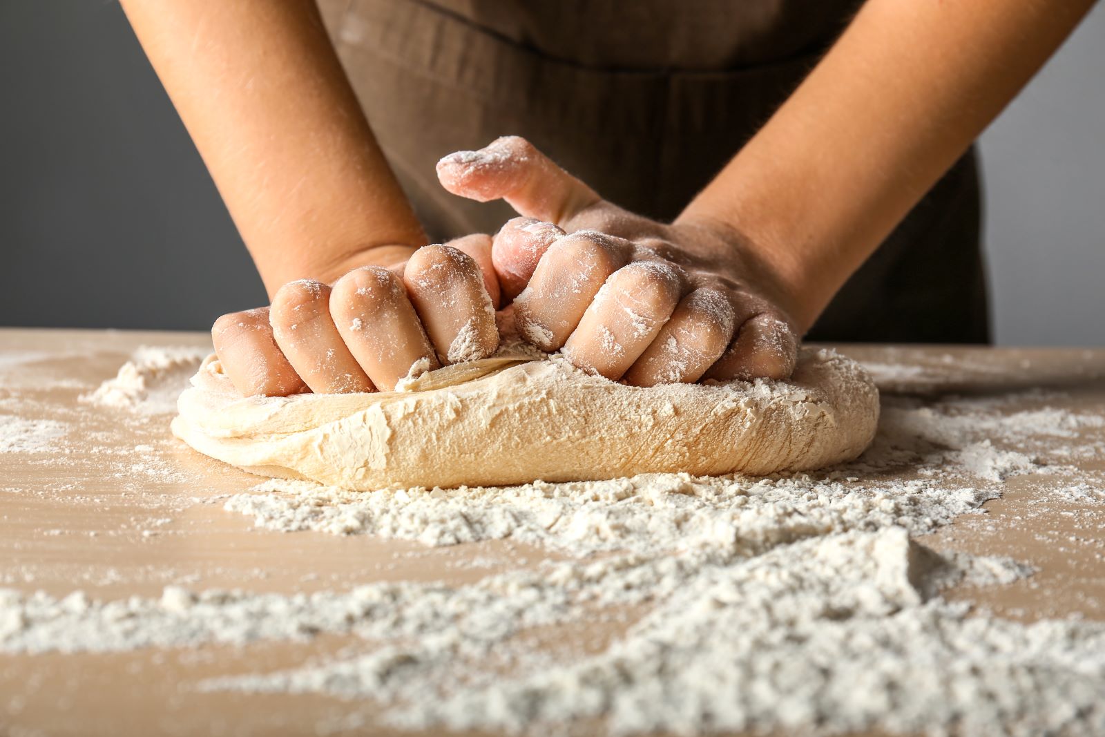 A freshly baked loaf of bread, sliced in half, revealing its soft interior and crusty exterior.